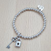 Silver Bead Stretch Bracelet with Key and Padlock